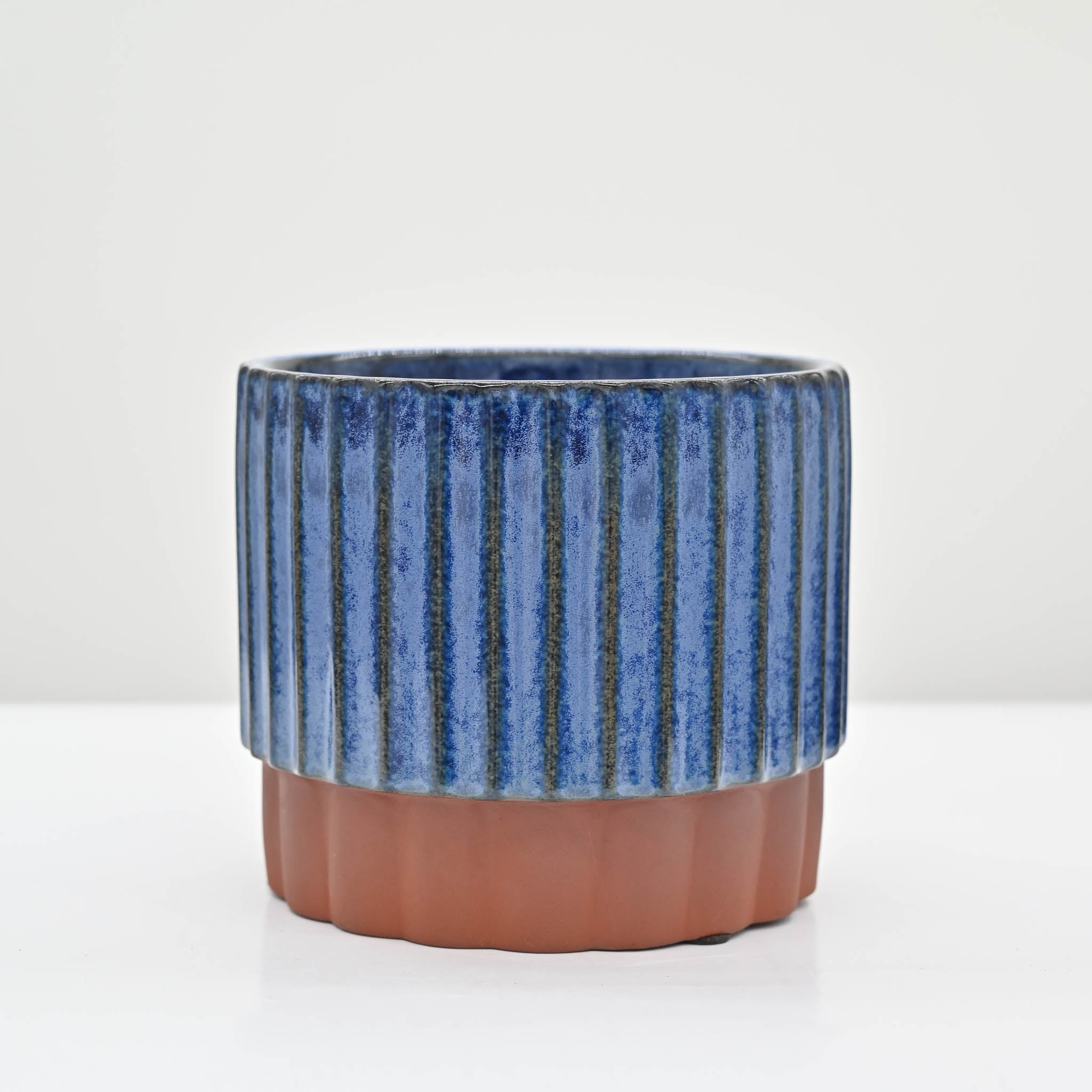 Blue and Terracotta colored pedestal planter